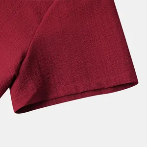 Detailed close-up showing the red waffle texture and stitching of men's casual shirt cuff