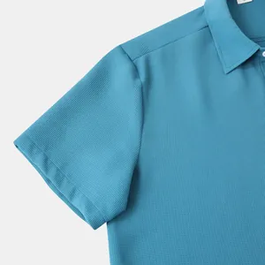 Close-up of blue men's short-sleeve shirt showing detailed waffle fabric texture
