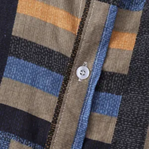 Close-up of a men's casual shirt featuring colorful stripes and button detail.
