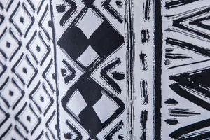 Macro detail of black and white ethnic geometric print on Hawaiian shirt fabric texture
