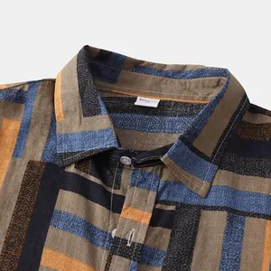 Close-up detail of men's casual shirt with color block geometric stripe pattern
