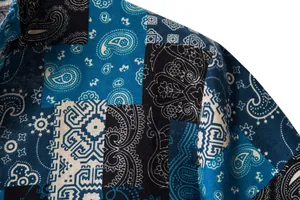 Macro detail of blue and black paisley patchwork on breathable men's cotton linen shirt