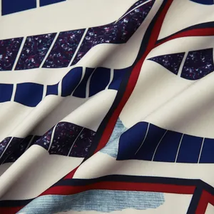 Gros plan détaillé d'un tissu à motif géométrique bleu marine et rouge pour chemise homme