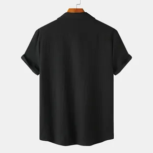 Rear view detail of a men's solid black short sleeve shirt featuring textured fabric
