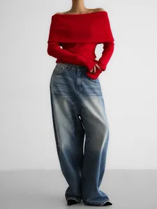 Stylish red off-the-shoulder long sleeve knit sweater with vintage wide-leg denim jeans