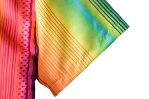 Close-up of colorful ethnic Hawaiian short sleeve shirt with vibrant gradient stripes