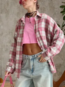 Oversized retro pink plaid shirt styled with a crop top and jeans for street style