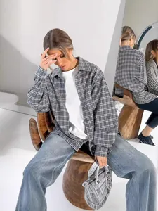 Stylish grey plaid oversized shirt for women featuring a chic lapel for autumn fashion look