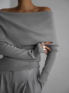 Detailed close-up of a grey off-the-shoulder slim-fit long sleeve knitted sweater for women