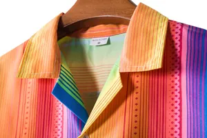 Detailed view of colorful ethnic pattern on Men's Hawaiian shirt collar and tag