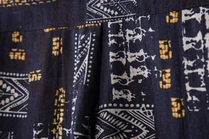 Macro view of navy ethnic print fabric showing tribal patterns and textile texture