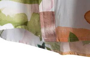 Detailed close-up showing the hemline stitching of a men's floral casual short-sleeve shirt