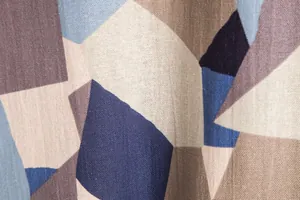 Macro view of retro geometric block print on men's linen-blend shirt fabric