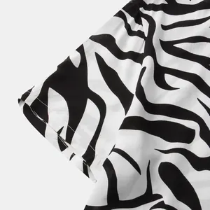 Macro view of the black and white zebra print texture on a men's short sleeve shirt