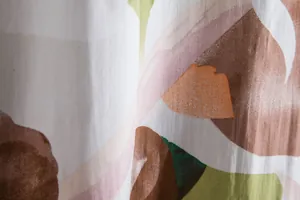 Macro detail of breathable fabric texture and abstract floral print on casual shirt