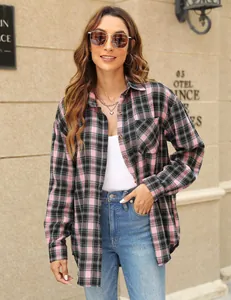 Detail of a pink and black plaid long-sleeve button-down shirt with a front pocket.