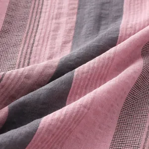 Close-up of pink and grey striped breathable fabric texture for men's summer beach shirt