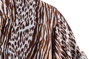 Detail macro shot of leopard print men's casual short sleeve shirt fabric texture