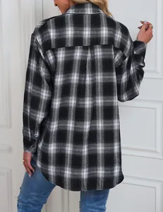 Detailed back view of a black and white plaid long-sleeved shirt with curved hem