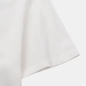 Close-up detail of a white short sleeve shirt sleeve showing fabric texture and stitching