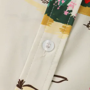 Close-up of white button and fine stitching on a floral print casual shirt for men.