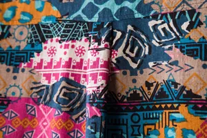 Close-up detail showing the vibrant ethnic geometric print on linen-blend casual shirt