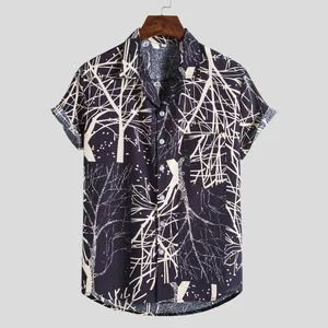 Close-up detail of men's vintage Hawaiian short sleeve shirt with tree branch print