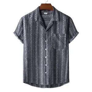 Detail of men's short sleeve shirt with ethnic geometric print on wooden hanger