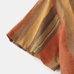 Detail of Hawaiian style striped men's shirt showing high-quality stitching and fabric texture