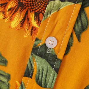 Vista macro di camicia da uomo con stampa girasoli, bottone bianco e cuciture precise