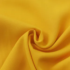 Close-up detail of high-quality bright yellow fabric texture for casual men's shirts