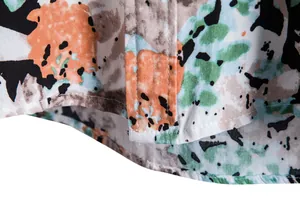 Detailed close-up showing floral print and stitching of a men's casual short sleeve shirt