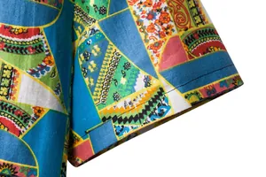 Detailed close-up of the short sleeve cuff on a colorful floral patchwork shirt