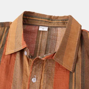 Close-up detail of Hawaiian style striped men's shirt collar with size M tag