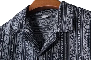 Close-up detail of the ethnic geometric print collar on a men's Hawaiian shirt