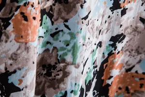 Macro detail of breathable fabric with vibrant abstract floral pattern for men's shirt