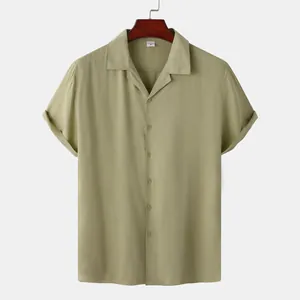 Detail view of sage green men's short-sleeved casual shirt with camp collar
