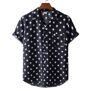 Detailed view of men's black short-sleeve Hawaii shirt with white star print and pocket