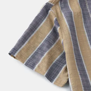Macro detail of vertical stripe pattern and stitching on a men's summer linen shirt