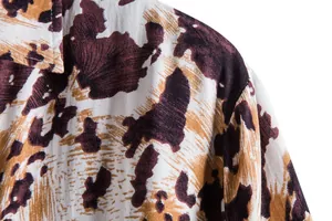 Close-up detail of shoulder and abstract floral pattern on men's casual shirt