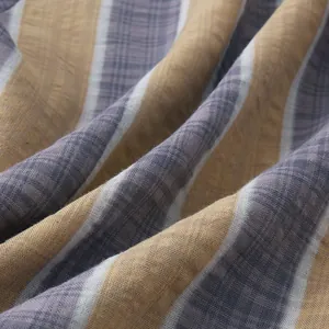 Macro view of striped linen-like fabric texture for summer Hawaiian casual beach shirts.