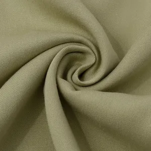 Macro view of olive green twill fabric texture for a high-quality casual men's shirt