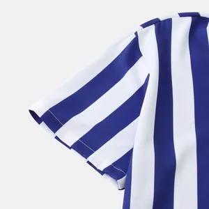 Close-up of blue and white vertical striped pattern on men's short-sleeved shirt