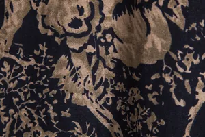 Macro detail of retro floral print fabric on a men's vintage Hawaiian leisure shirt