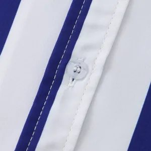 Detailed macro view of blue white striped shirt showing fabric texture and button