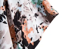 Detail of abstract floral print and stitching on men's casual short sleeve shirt