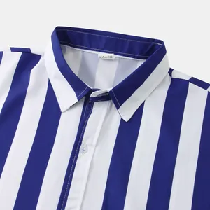 Close-up detail of the collar and white buttons on a blue and white striped men's shirt