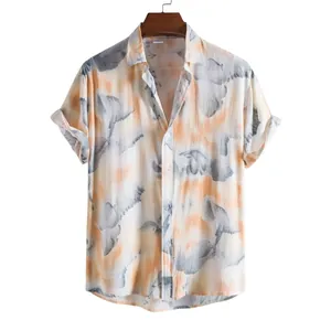 Close-up of men's casual short-sleeve shirt featuring an abstract orange and grey tie-dye print