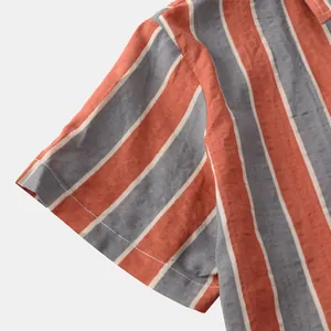 Close-up of short sleeve cuff on a vertical striped Hawaiian style casual men's shirt