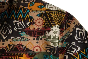 Detailed macro view of ethnic tribal print fabric on a men's summer shirt sleeve